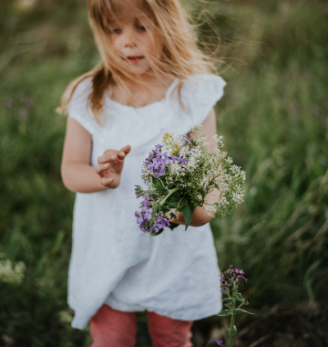 Girl with a bouquet of wildflowers