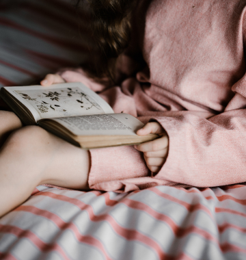 Girl with a book on her lap